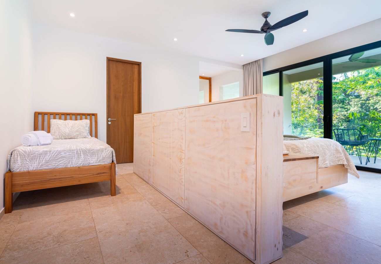 Bedroom with wooden partition and seating area