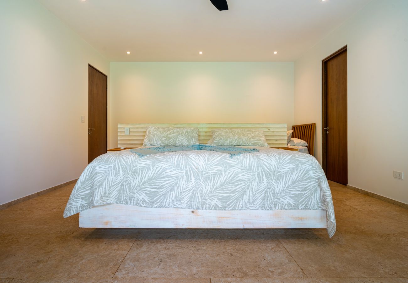 Primary bedroom with minimalist design and natural light