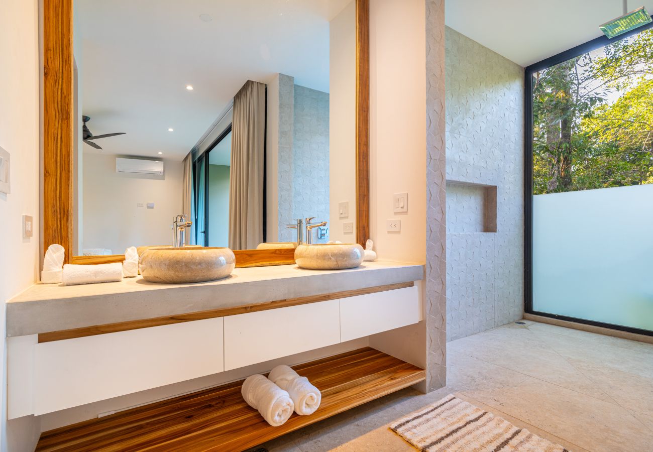 Bathroom vanity with double sinks and natural light